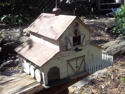 This is a barn that has 3 rooms for birds