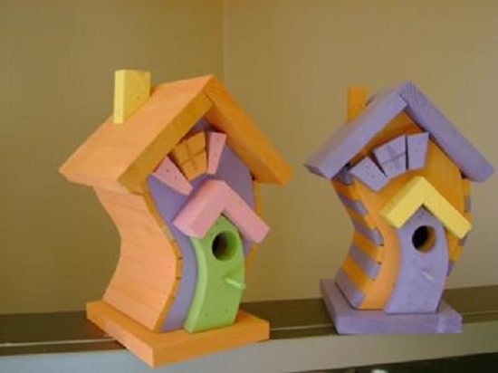 two crooked bird houses on display