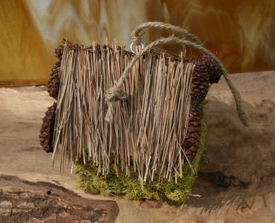 Birdhouse Covered with Pine Needles and Moss