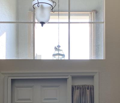 One of parents in light but empty nest above