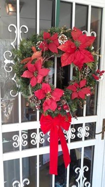 bird nest in christmas door wreath
