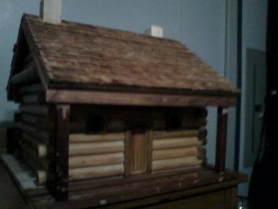 completed log cabin style birdhouse