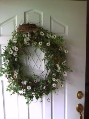 robin nest on top of door wreath